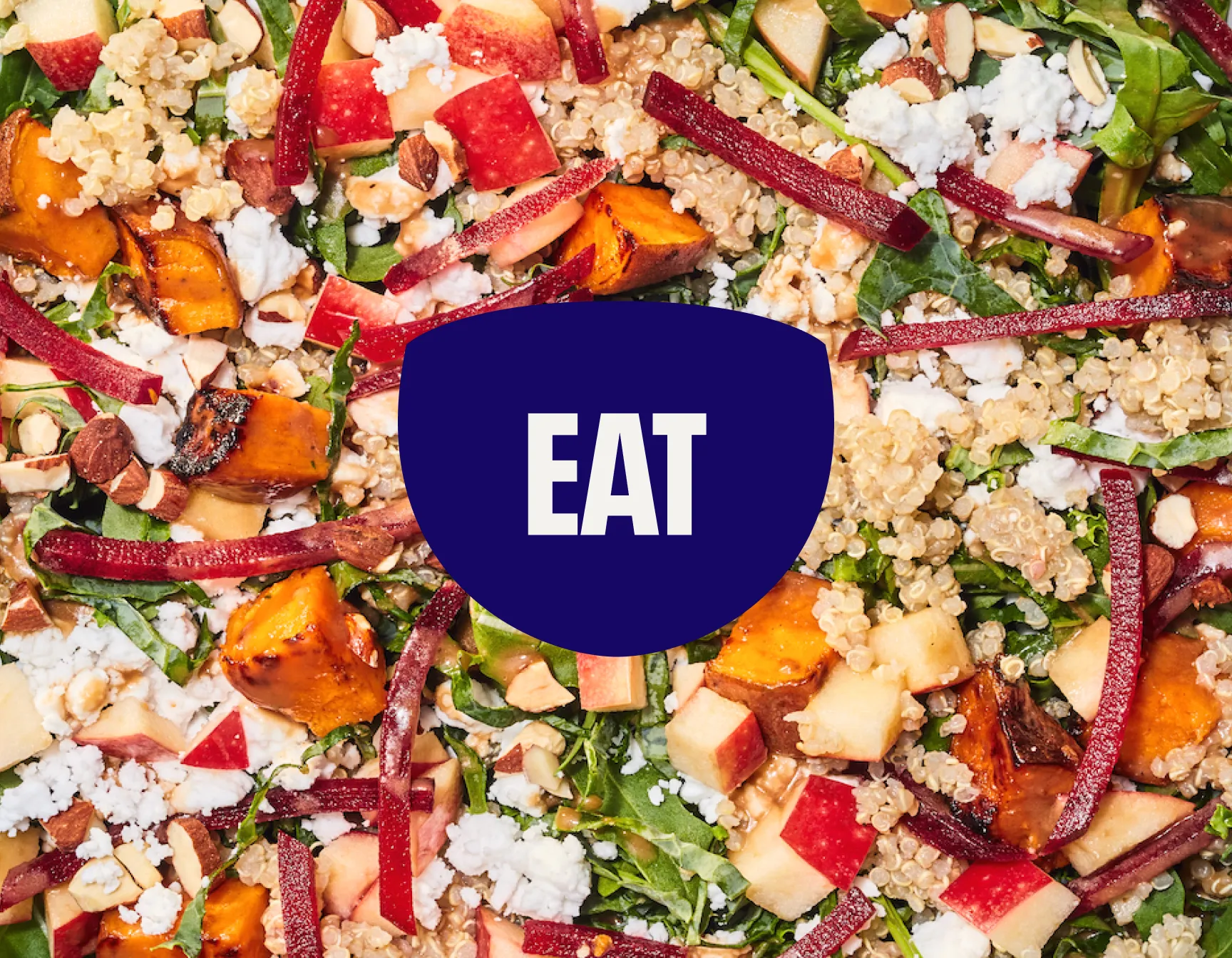 Detailed photograph of a salad with the word "EAT" overlaid