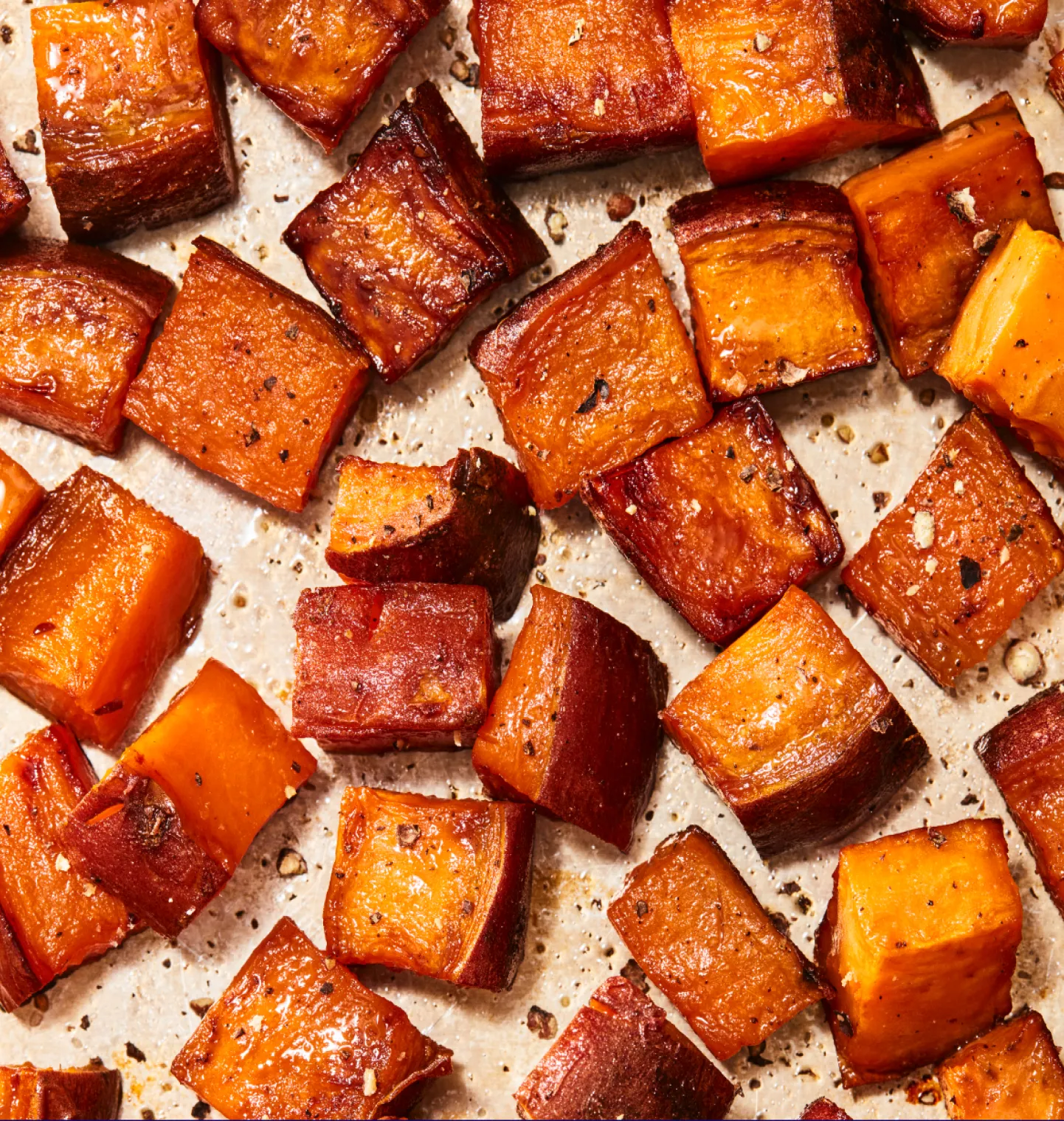 A detail photograph of tray of cooked sweet potato.